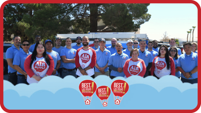 Air supply team posing with truck